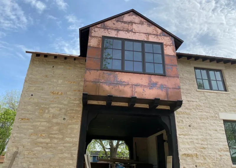 Copper metal panel facade on a stone building for Metal Roof Coating in Bluffton